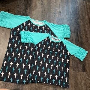 Adult small, adult extra large, and child’s extra large cross t shirts